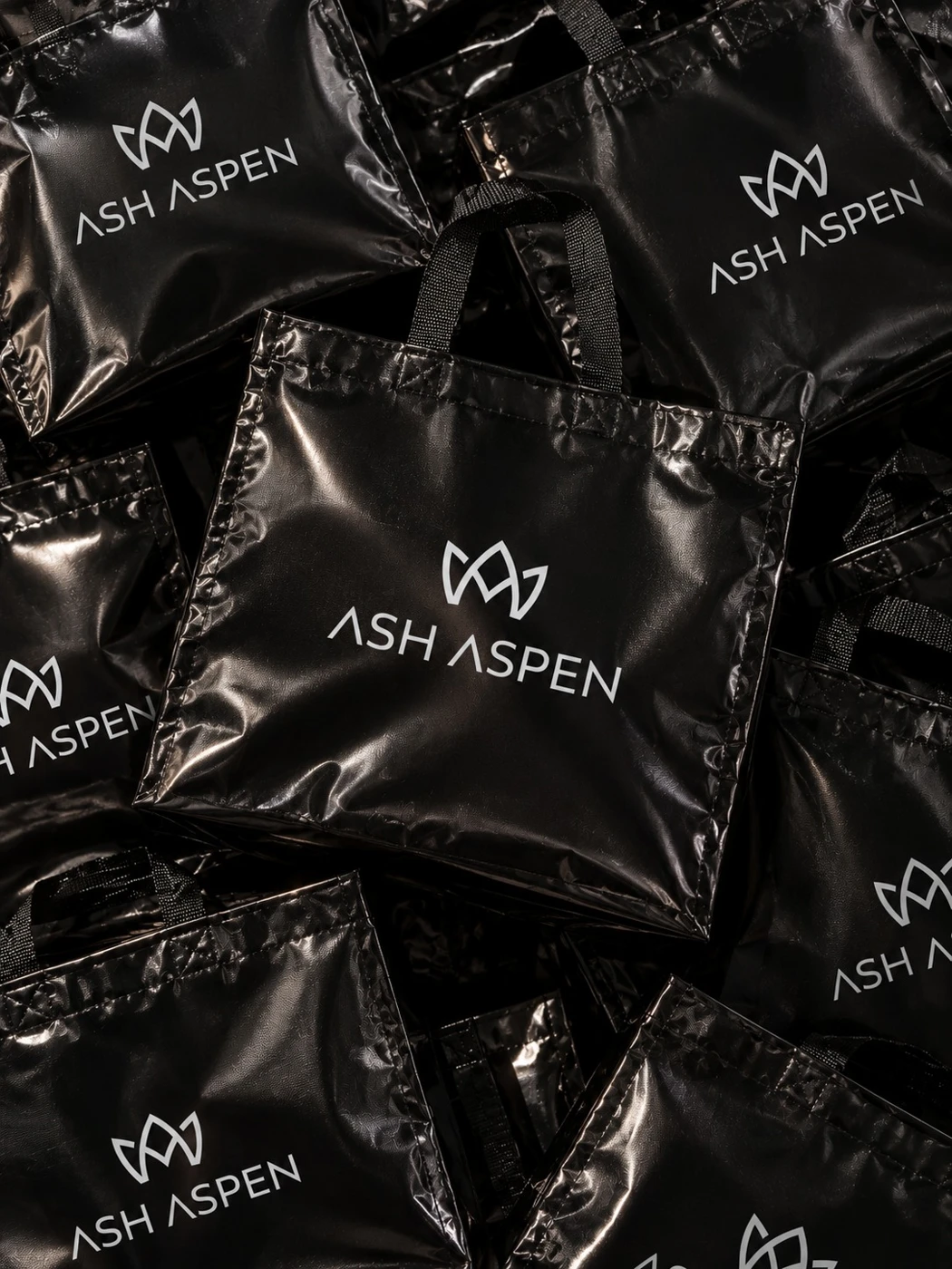 Ash Aspen black shopping bags with white brand logo